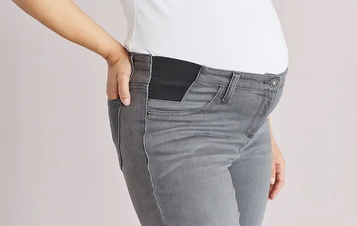 A model in maternity jeans 
