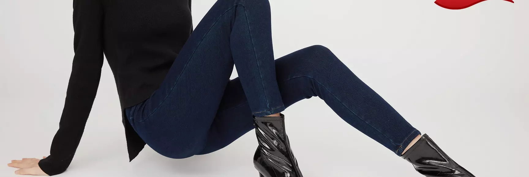 A woman models performance stretch denim jeans with LYCRA® dualFX® technology, a patented dual core spandex fiber.