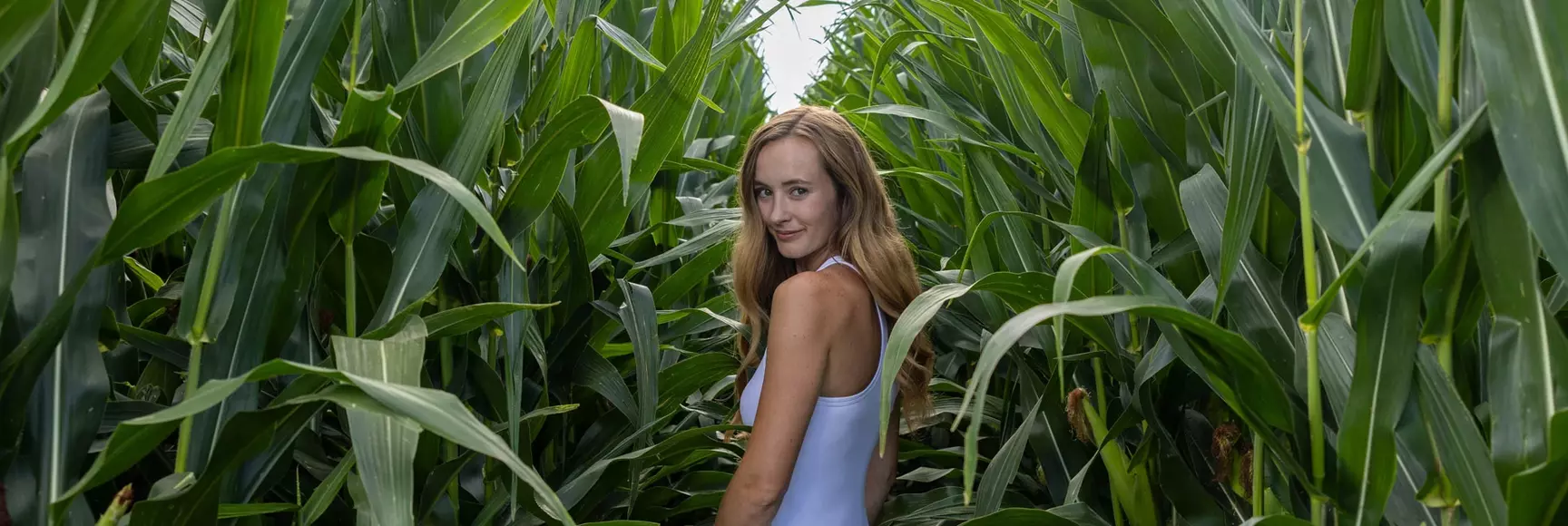 model in cornfield