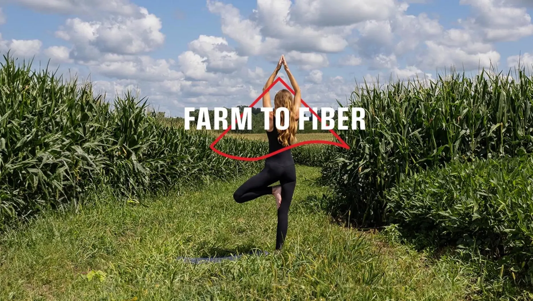 ISPO farm to fiber woman in tree pose in field