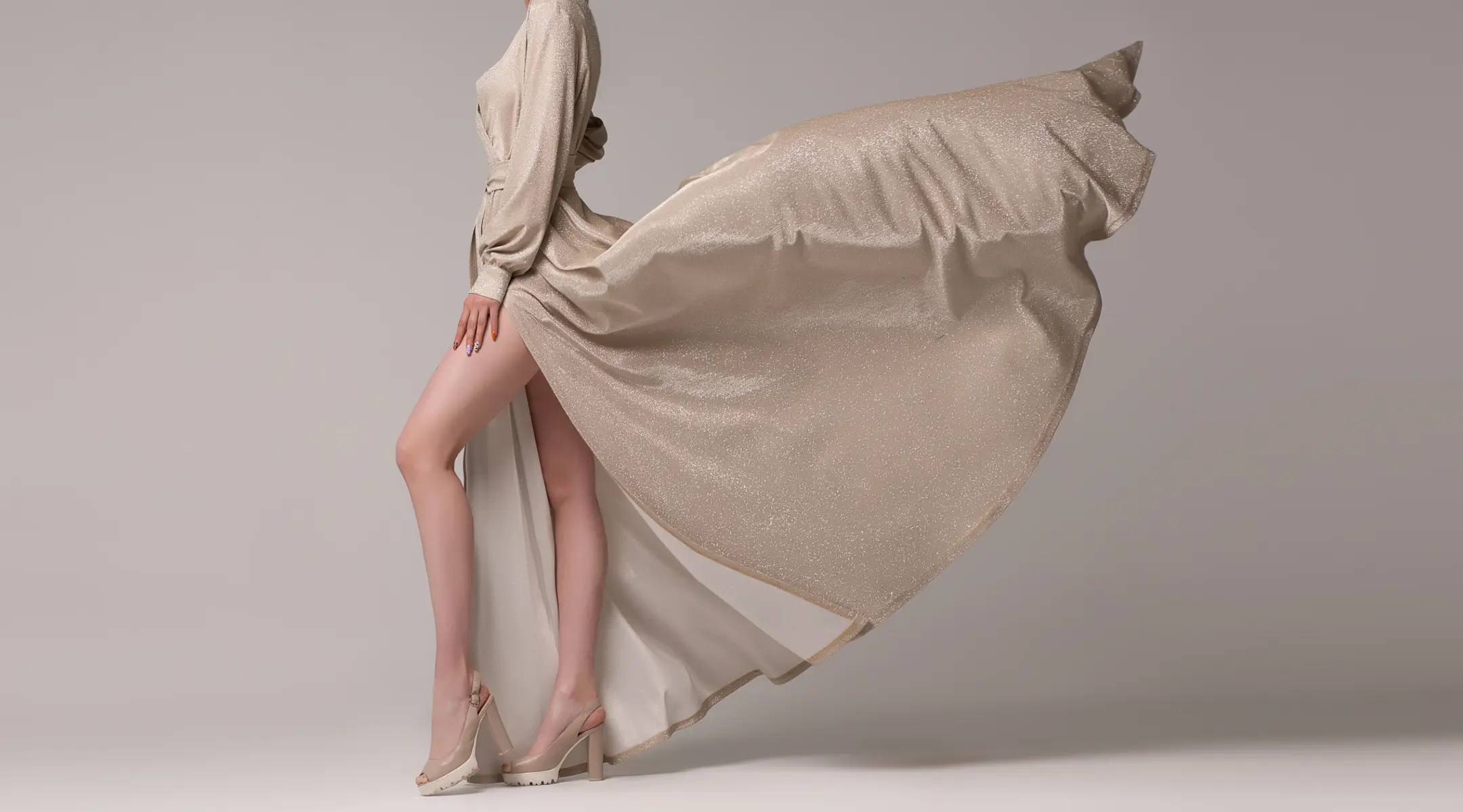 Model in designer dress. LYCRA® fiber was named a top apparel innovation of the 20th century by American fashion designers. 