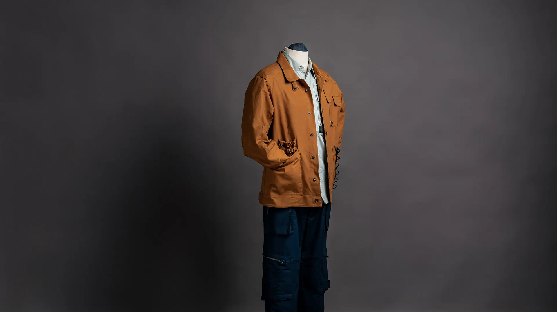 A brown workwear jacket on a mannequin.