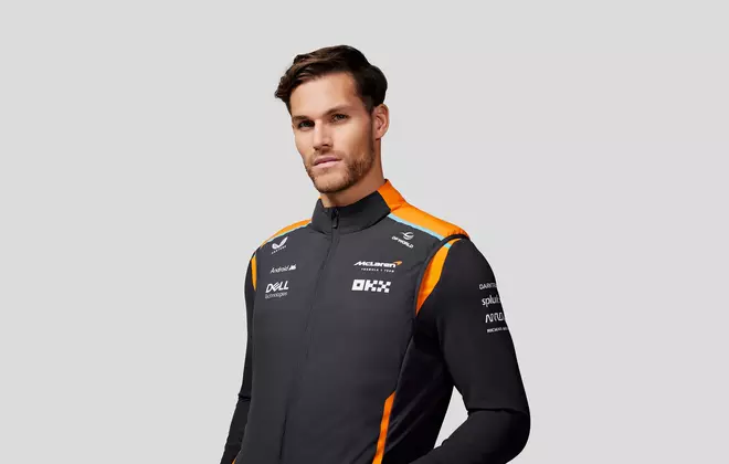a model wears the new Castore and McLaren F1 Teamwear hybrid vest