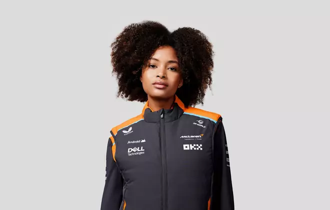 a model wears the new Castore and McLaren F1 Teamwear hybrid vest