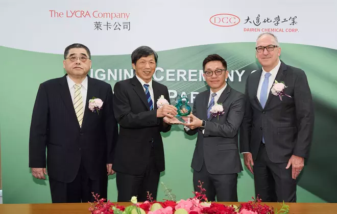 The LYCRA Company presents the Green Partner Award to DCC. (l. to r.) Shean-Tung Lin of DCC; Fu-Chu Huang of DCC; Simon Chuang of The LYCRA Company; and Steve Stewart of The LYCRA Company.